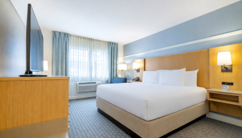 Experience a restful stay in our King room, thoughtfully designed for comfort and relaxation at Two Trees Inn.