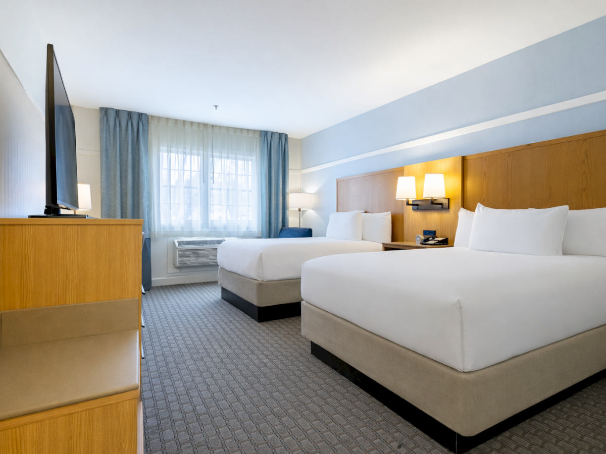 Relax in comfort at Two Trees Inn with spacious guest rooms designed for a restful stay.